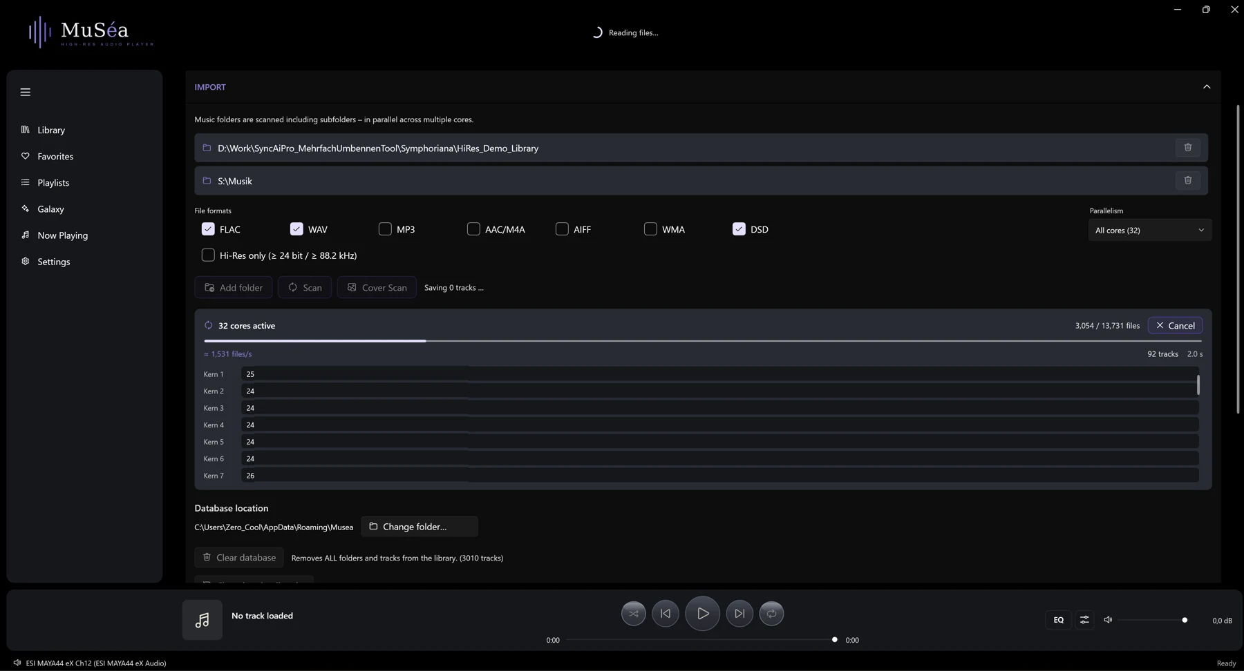 Screenshot 05: Import in progress: progress bar, "N cores active", throughput "≈ N files/s" and the tracks found